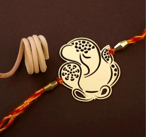 Ganesha design Rakhi cum keychain ring for Bhai/brother crafted in brass with golden finish