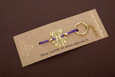 Teddy bear design Rakhi cum keychain ring for baby Bhai/brother crafted in brass with golden finish