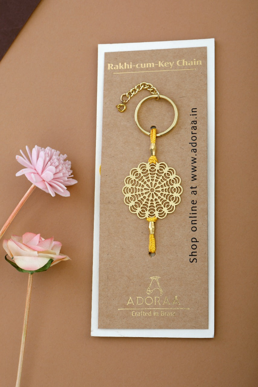 Floral design Rakhi cum keychain ring for Bhai/brother crafted in brass with golden finish