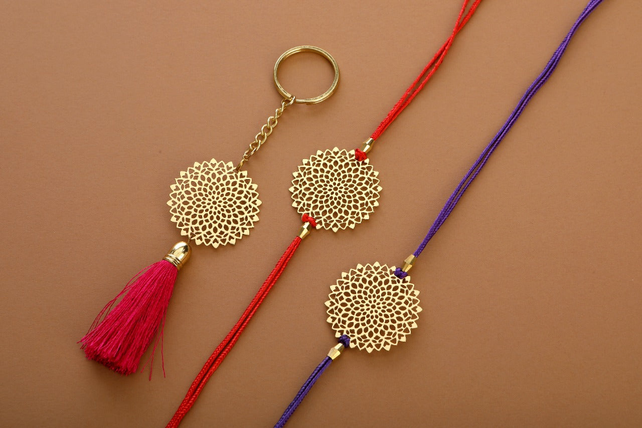 Lotus design Rakhi cum keychain ring for Bhai/brother crafted in brass with golden finish