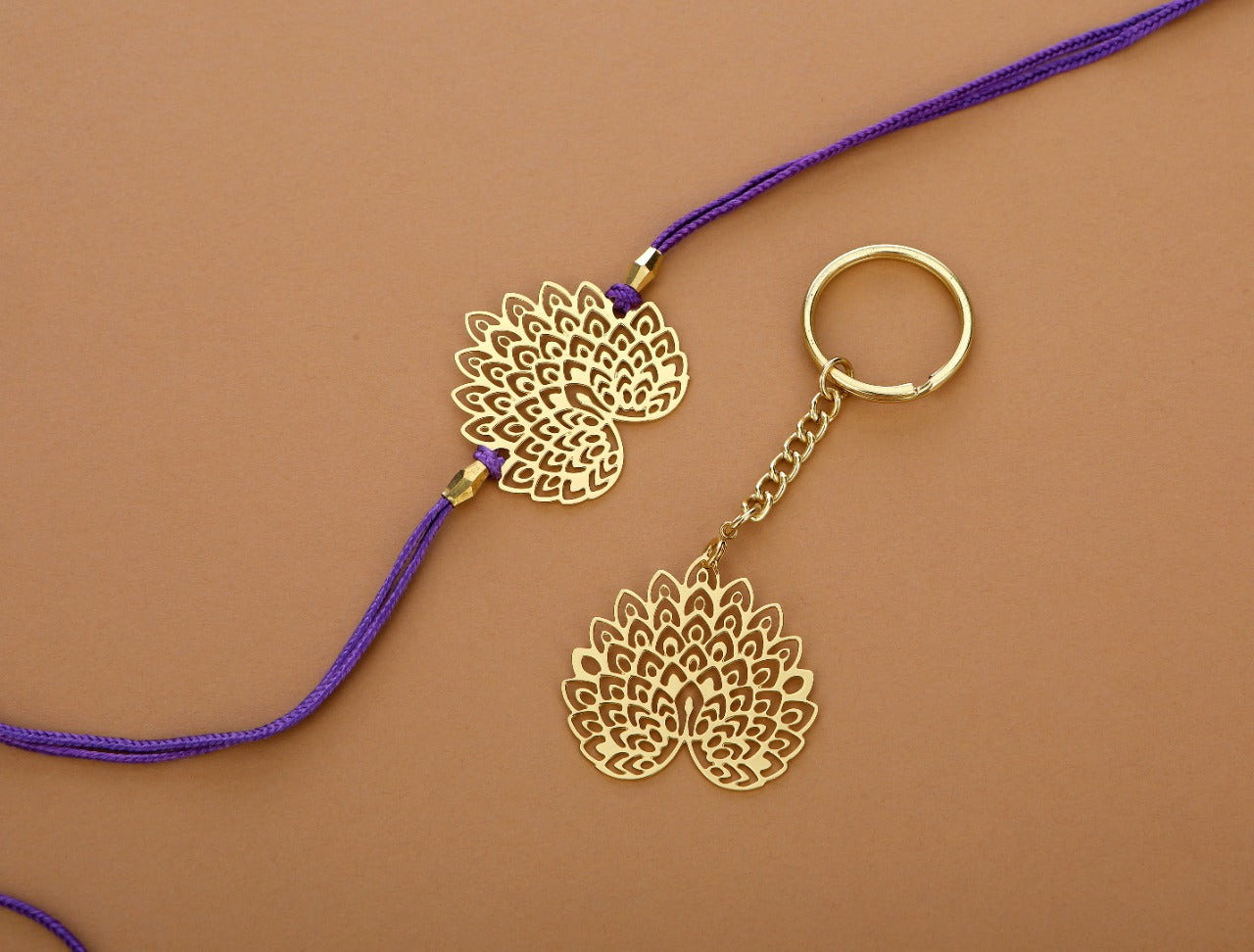 Peacock design Rakhi cum keychain ring for Bhai/brother crafted in brass with golden finish