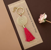 Dial design Rakhi with hanging tassel for bhabhi cum keychain ring crafted in brass with golden finish