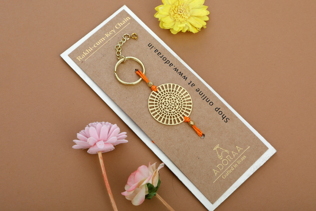 ADORAA's Dial design Rakhi cum keychain ring for Bhai/brother crafted in brass with golden finish