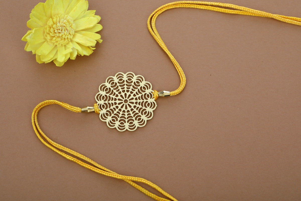 Floral design Rakhi cum keychain ring for Bhai/brother crafted in brass with golden finish
