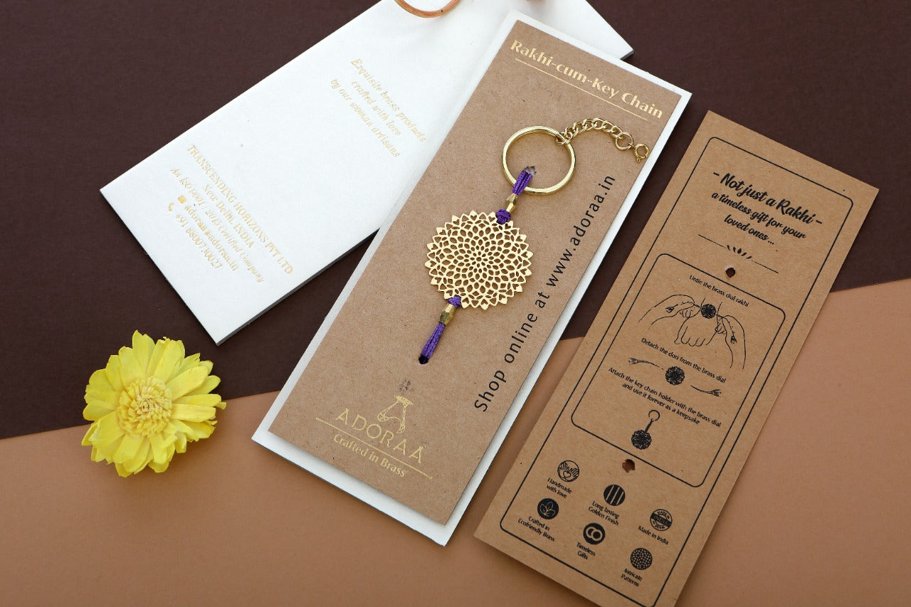 ADORAA's Lotus design Rakhi cum keychain ring for Bhai/brother crafted in brass with golden finish