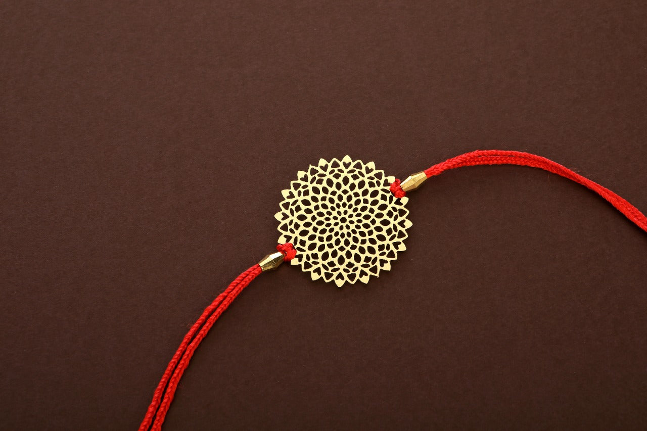 Lotus design Rakhi cum keychain ring for Bhai/brother crafted in brass with golden finish