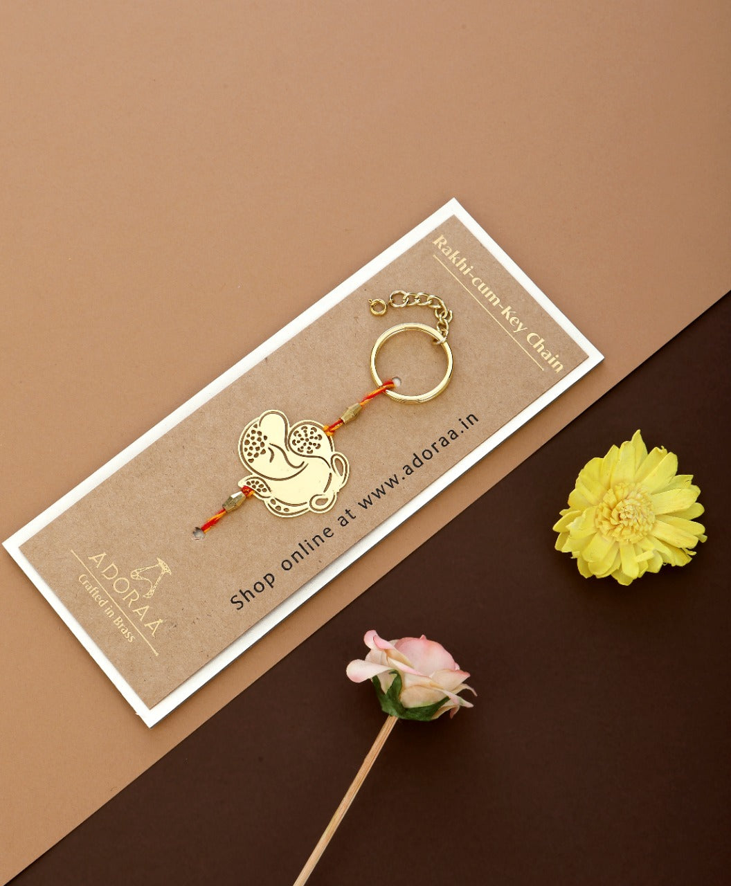 ADORAA's Ganesha design Rakhi cum keychain ring for Bhai/brother crafted in brass with golden finish