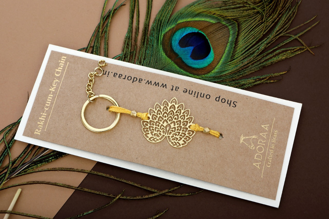 Peacock design Rakhi cum keychain ring for Bhai/brother crafted in brass with golden finish