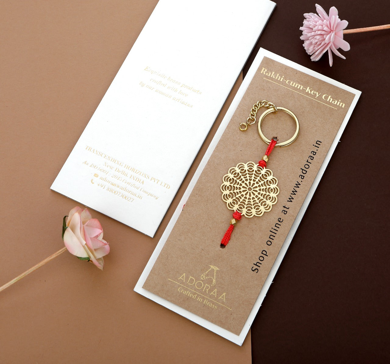 ADORAA's Floral design Rakhi cum keychain ring for Bhai/brother crafted in brass with golden finish